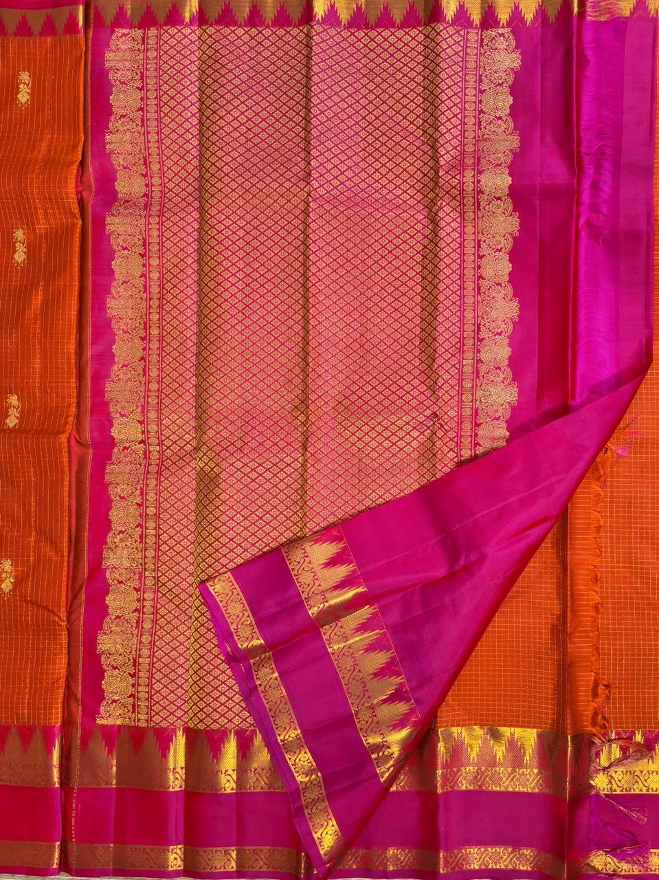 Orange pure handloom kanchipuram silk saree with vibrant pink temple border