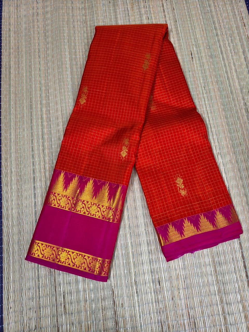 Orange pure handloom kanchipuram silk saree with vibrant pink temple border